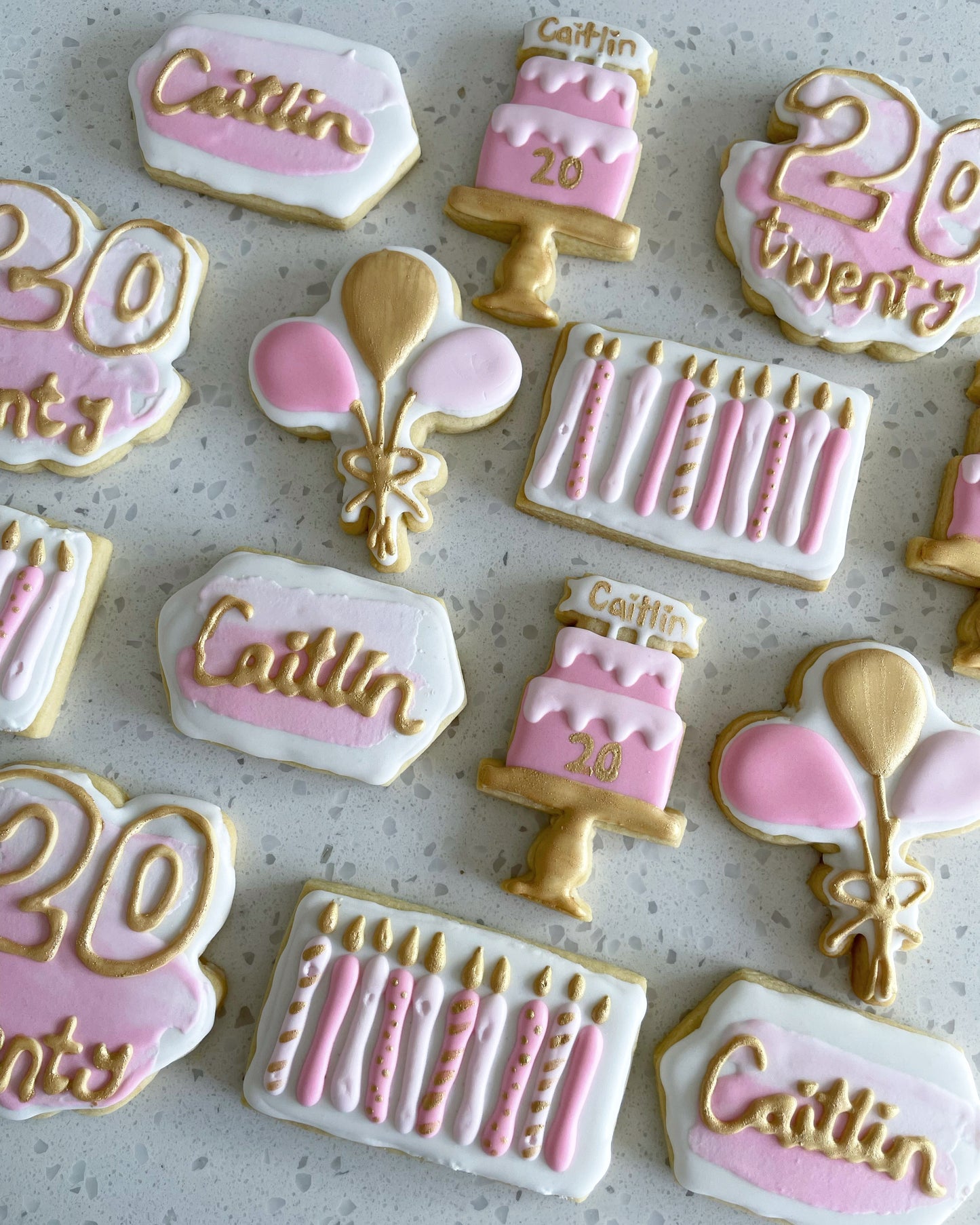 20th Birthday Cookies. Birthday cake, candle, balloon, name, and number designs. Pink, white, and gold cookies