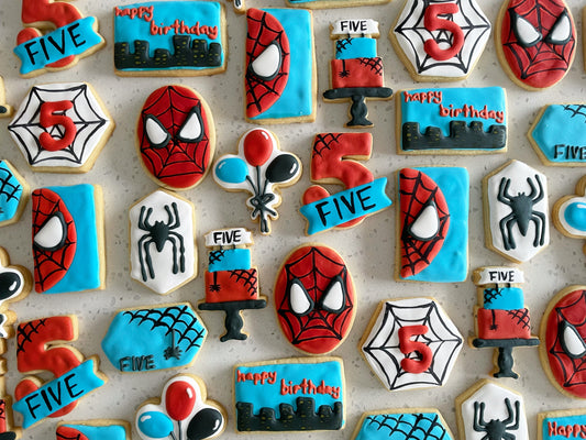 Spiderman 5th Birthday Cookies. Birthday cake, balloon, number, happy birthday, and Spiderman designs. Red, white, blue, and black cookies